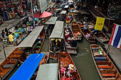 Thailand, Locals sell fruits, food and products at Damnoen Saduak floating market near Bangkok 